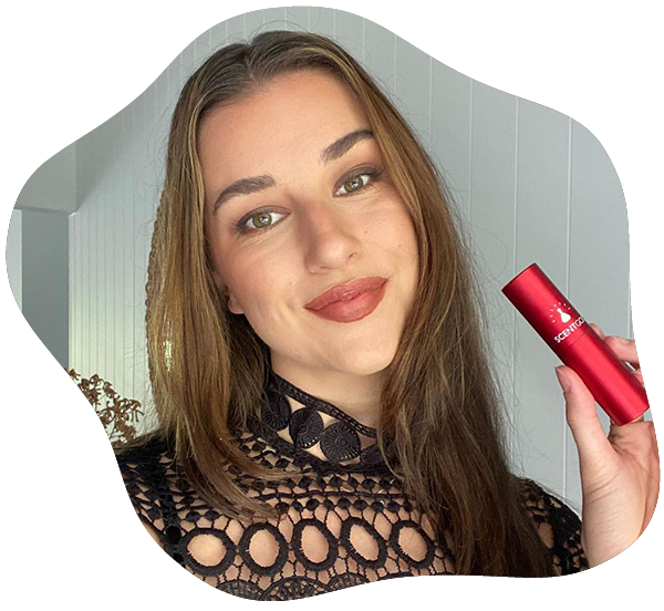 Woman holding ScentGod Perfume